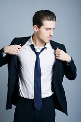 Image showing Elegant, fashion and a man in a suit for business isolated on a dark background in a studio. Thinking, corporate and a businessman with style for executive, professional and career as a boss