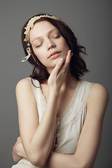 Image showing Fashion, natural beauty and woman with eyes closed in studio isolated on a gray background. Beautiful, vintage clothes and female model with retro style, headband and skincare for healthy skin.