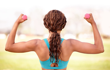 Image showing Fitness, park and woman with dumbbell for exercise, body builder training and workout. Sport, weightlifting and back of female athlete with strong muscle for wellness, healthy lifestyle and wellbeing