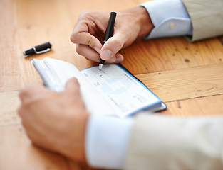 Image showing Hands, businessman sign cheque or accountant closeup and signature for consent or confirmation. Finance or payment, money or investment and financial advisor finalising transaction or paperwork