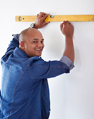 Image showing Spirit meter, man portrait and pencil measure for maintenance, home improvement and repair. Construction, builder and contractor alignment drawing on wall for level measuring of handyman and line