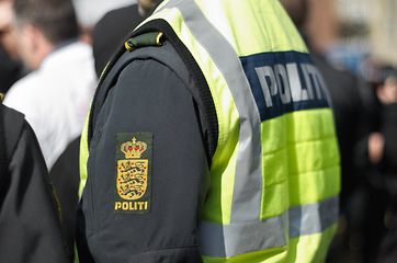 Image showing Protest, security and arm of police officer in city for safety, law enforcement and government. Freedom, human rights and politics with person in demonstration rally for movement, march and activism