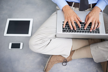 Image showing Hands, business man and typing with laptop, cellphone and table for communication, contact or email on floor. Businessman, keyboard and computer for networking, social media or technology in top view