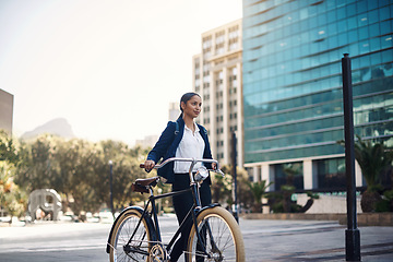 Image showing Transport, walking and businesswoman with a bicycle in the city, morning and street for work routine. Eco friendly, travel and professional female employee commuting to office with bike in urban town