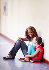 Image showing Teacher, child and talking or conversation at school for support, trust or counselling. Happy black woman working at school for student discussion or education on bullying, learning and development