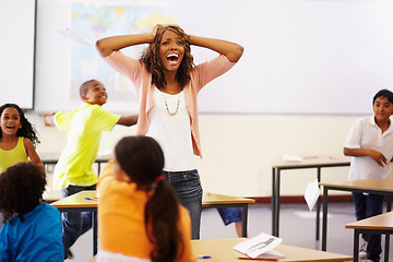 Image showing Stress, teacher shouting and black woman in classroom with children running around. Education, headache and female person screaming with burnout, tired or fatigue with kids in busy class at school.