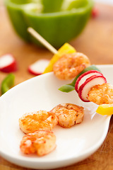 Image showing Food, nutrition and prawn on a plate in a restaurant for hospitality in a luxury fine dining establishment. Shrimp, skewer and meal on a kitchen counter ready for serving in a hotel for healthy lunch