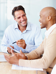 Image showing Meeting, happy business men with papers and talking or negotiating in work office together. Interview or contract agreement, teamwork or collaboration and coworkers discussing proposal or promotion