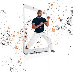 Image showing Color splash, digital tablet and frame by karate man in studio for fitness, training and creative sport on white background. Pop, art and screen box by taekwondo male with online app for martial arts