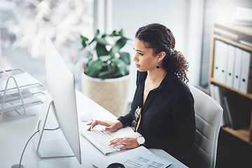 Image showing Corporate, typing and a woman with an email on a computer, research or secretary work. Analytics, desk and a female receptionist with a pc in an office for communication, connectivity and working