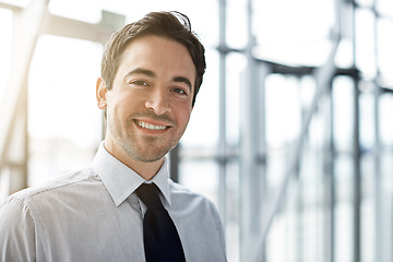 Image showing Portrait, business and man with a smile, lobby and consultant with confidence, occupation and career. Face, male person and employee in a hallway, happiness and professional with startup success