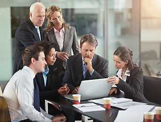 Image showing Business, staff and group in a meeting, laptop and planning with collaboration, partnership and development. Coworkers, employees and men with women, share ideas and technology with focus and startup