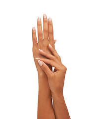 Image showing Touching, soft and hands with a spa manicure isolated on a white background in a studio. Skincare, beauty and a woman showing a hand, luxury treatment and feeling healthy skin from cosmetics