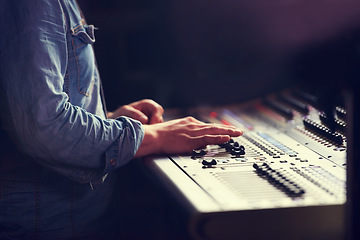 Image showing Closeup, hands and sound engineer with a mixing desk, music and artist recording with equipment. Fingers, creative and musician with automatic equalizer, professional and buttons for songs and sounds