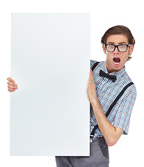 Image showing Portrait, wow and mockup poster with a man in studio isolated on a white background for advertising. Surprise, announcement and space with a shocked or funny male nerd holding a placard for branding