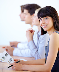 Image showing Portrait, workshop and a business woman in the boardroom during a strategy or planning meeting. Corporate, professional and seminar with a young female employee at a table during a presentation