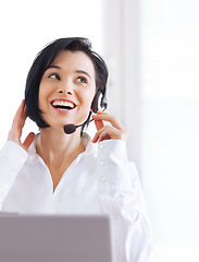 Image showing Call center, customer support and happy woman doing online consultation in the office. Contact us, smile and female telemarketing representative, agent or consultant working with headset in workplace