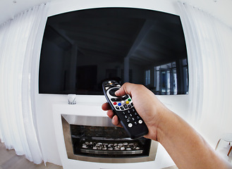 Image showing POV, television and hands of man with remote control in a living room for relax, weekend and movie. Channel, change and male in a lounge watching tv, resting and day off in his home with subscription