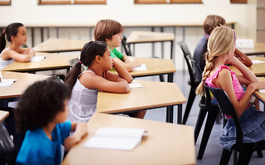 Image showing Education, learning and children in classroom with focus, attention and study at Montessori school. Group of students at desk studying, child development and kids with concentration in lesson or test