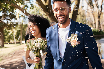 Image showing Wedding day, couple and confetti outdoor with happiness and smile from marriage event. Celebration, African people and bride walking with flower bouquet at love and trust commitment ceremony