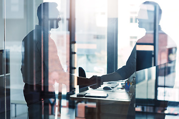 Image showing Business, glass and men with handshake, collaboration and meeting with negotiation, partnership and conversation. Male employees, professional and coworkers with greeting, welcome and teamwork