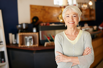 Image showing Elderly, woman and portrait with crossed arms work in coffee shop for retirement for a small business. Senior female, professional and cafe for investment is working in a store for with a smile.