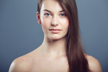 Image showing Skin, beauty and face portrait of a woman in studio with natural makeup and cosmetics. Headshot of aesthetic gen z female model on a grey background for glow, hair care and facial dermatology shine
