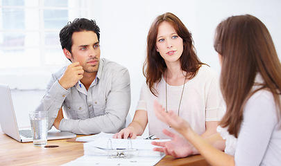 Image showing Meeting, talking and listening business people with manager, documents and seminar collaboration, advice or project ideas. Paperwork, portfolio or proposal of speaker and team listening to discussion