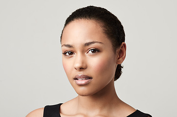 Image showing Black woman, portrait and natural beauty with confidence and cosmetics in a studio feeling proud. Isolated, white background and young face of a African female person and model with makeup and pride