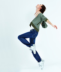 Image showing Man, jump and dance in the air for happiness with action, movement and balance of body isolated on white studio background. Male ballet dancer, happy and free with energy or dancing to music for fun