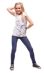 Image showing Young girl, portrait and smile with fun pose for dancing and celebration with energy. White background, studio and preteen female person with a teenager model with cute and modern fashion with dance