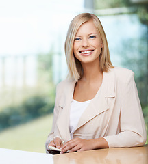 Image showing Business woman, portrait and smile in office with confidence, motivation and excited for entrepreneurship. Young businesswoman, entrepreneur and happy in workplace for startup management at desk