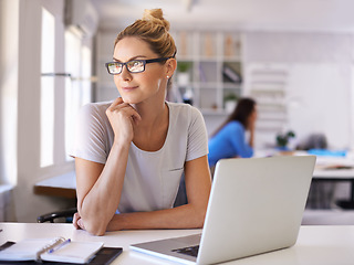 Image showing Thinking, fashion and designer with woman and laptop for creative, planning and retail. Boutique, small business and internet with female employee in workshop for store, industry and tailor