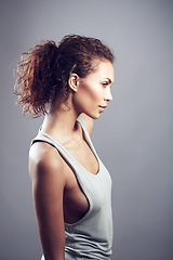 Image showing Woman, curly hair and thinking in studio profile with beauty, wellness and healthy by gray background. Girl, model and isolated with fashion, clothes and think of idea, memory or remember by backdrop