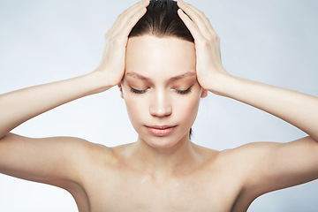 Image showing Woman, beauty and hands on head for hair care, skincare or cosmetics treatment on gray studio background. Girl, face and closed eyes to relax at spa for scalp, body and facial massage or selfcare