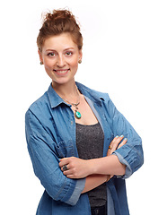 Image showing Portrait, fashion and arms crossed with a woman in studio isolated on a white background for contemporary style. Smile, clothes and confident with a happy young female hipster in a denim jacket