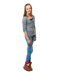 Image showing Studio, full portrait and a happy teenage girl for fashion or beauty or pose and standing against a white background. Style, face and young girl smile or child model confident in jeans and shirt