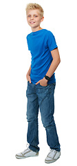 Image showing Boy teenager, fashion and studio portrait with smile, confidence and happy by white background. Young male model, kid and trendy clothes with happiness, blue jeans and youth culture by backdrop