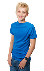 Image showing Portrait, children and fashion with a boy in blue in studio isolated on a white background for trendy style. Smile, kids or casual clothes with a happy young male child standing hands in pockets