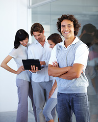 Image showing Leader, smile and portrait of a businessman in leadership at a digital agency or company with arms crossed. Planning, tablet and manager with a his team in a meeting and discussion strategy