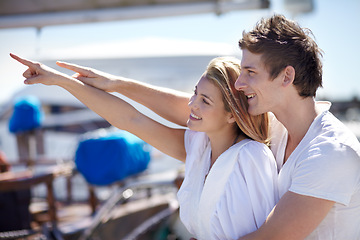 Image showing Happy, travel and couple point on yacht with smile on summer holiday, vacation and adventure on ocean. Love, travelling and man and woman pointing on luxury cruise for journey, romantic trip and fun