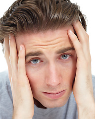 Image showing Man, depression and hands in studio with thinking, mental health problem and frustrated by white background. Closeup face, sad student and lost with anxiety, scared and depressed with stress on mind