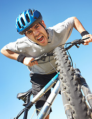 Image showing Portrait, angry cyclist and crazy face with bicycle closeup on blue sky background or cycle training, outdoor workout and healthy cardio fitness. Man, agro shout or yelling about bike workout