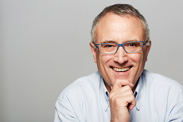 Image showing Senior man, portrait and smile in studio with happiness, pride and confident by gray background. Elderly guy, happy and excited face for experience, knowledge and retirement by backdrop with glasses