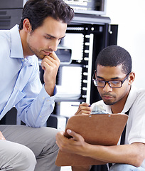 Image showing Teamwork, IT and men with clipboard in server room for maintenance, inspection and fixing. Checklist, network technician and tech support for cybersecurity, information and help in data center.