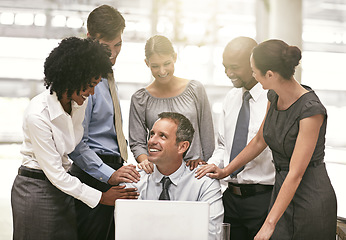 Image showing Laptop, collaboration and achievement with a business team congratulating a male colleague in the office. Computer, proud or motivation with a group of colleagues working together to achieve success