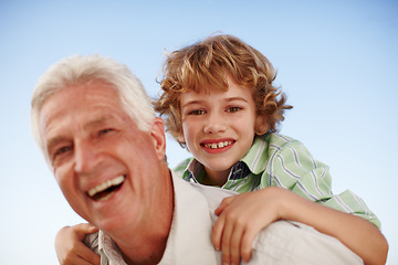 Image showing Portrait, grandfather and boy with a smile, piggy back and bonding outdoor, sky and happiness. Face, happy grandad and male grandchild with joy, loving and care with relationship, cheerful and family