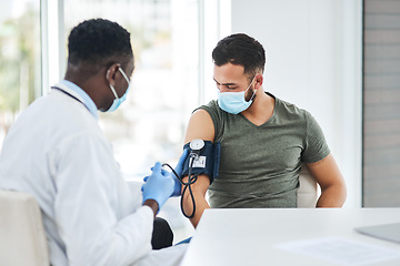 Image showing Covid, mask and doctor test blood pressure of patient in a hospital or cardiology exam by medical worker in a clinic. Hypertension, help and professional healthcare employee consulting man for corona