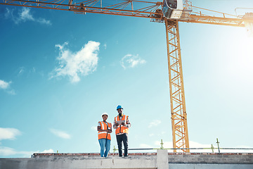 Image showing Engineering, tablet and team on building roof at construction site for vision, development or architecture. Black woman and man outdoor for engineer project or safety inspection with sky mockup