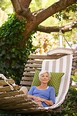 Image showing Senior, woman and retirement in the garden during a summer vacation is motivation for happiness for vision. Elderly, person and tree while thinking in spring is calm in the environment with a smile.